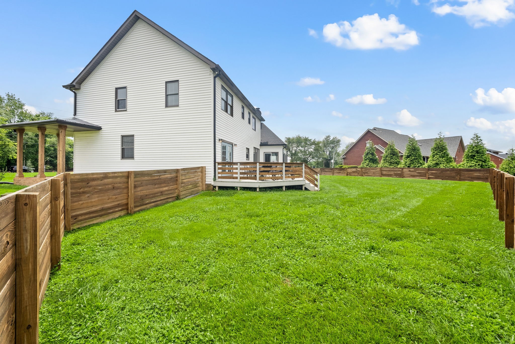 4921 Sango Road Clarksville, TN 37043 - Photo 50 of 52 a view of a house with a yard and sitting area