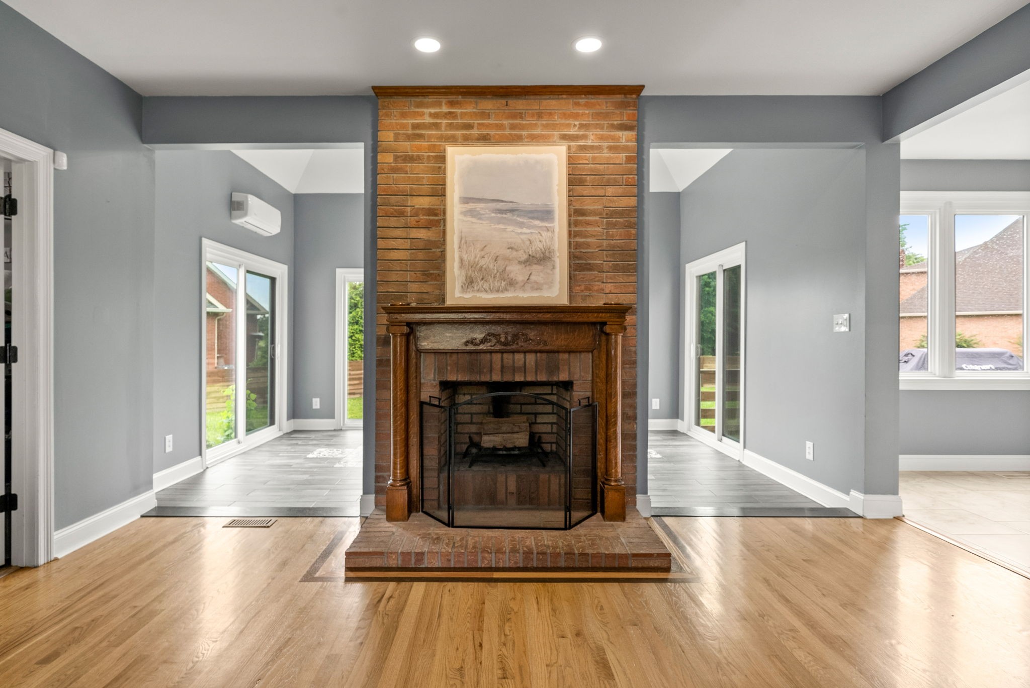 4921 Sango Road Clarksville, TN 37043 - Photo 9 of 52 a living room with a fireplace and wooden floor