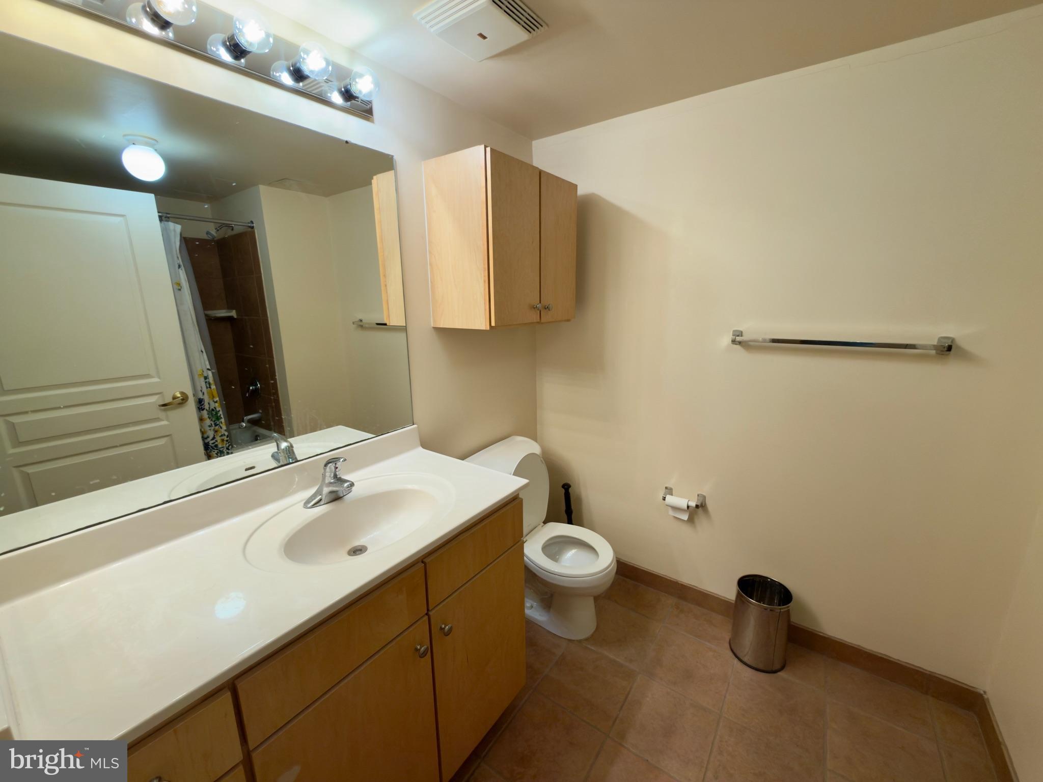 631 D Street Northwest, Unit 1038 Washington, DC 20004 - Photo 16 of 56 a bathroom with a sink and a toilet