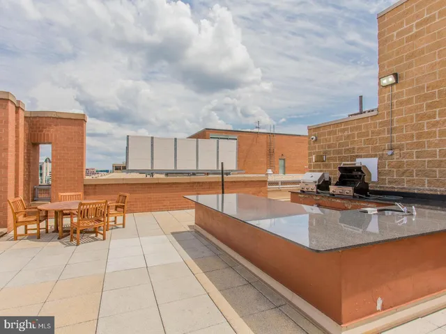 a swimming pool with outdoor seating and yard