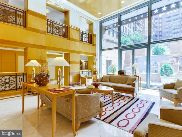 a view of a lobby with furniture and chandelier