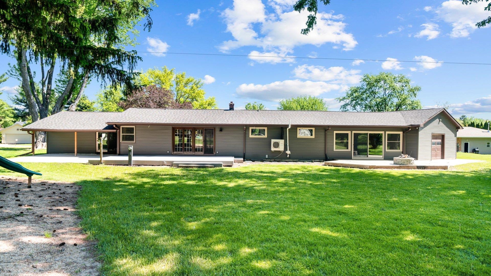 313 West Margaret Fuller Road Oregon, IL 61061 - Photo 42 of 46 a front view of a house with a garden