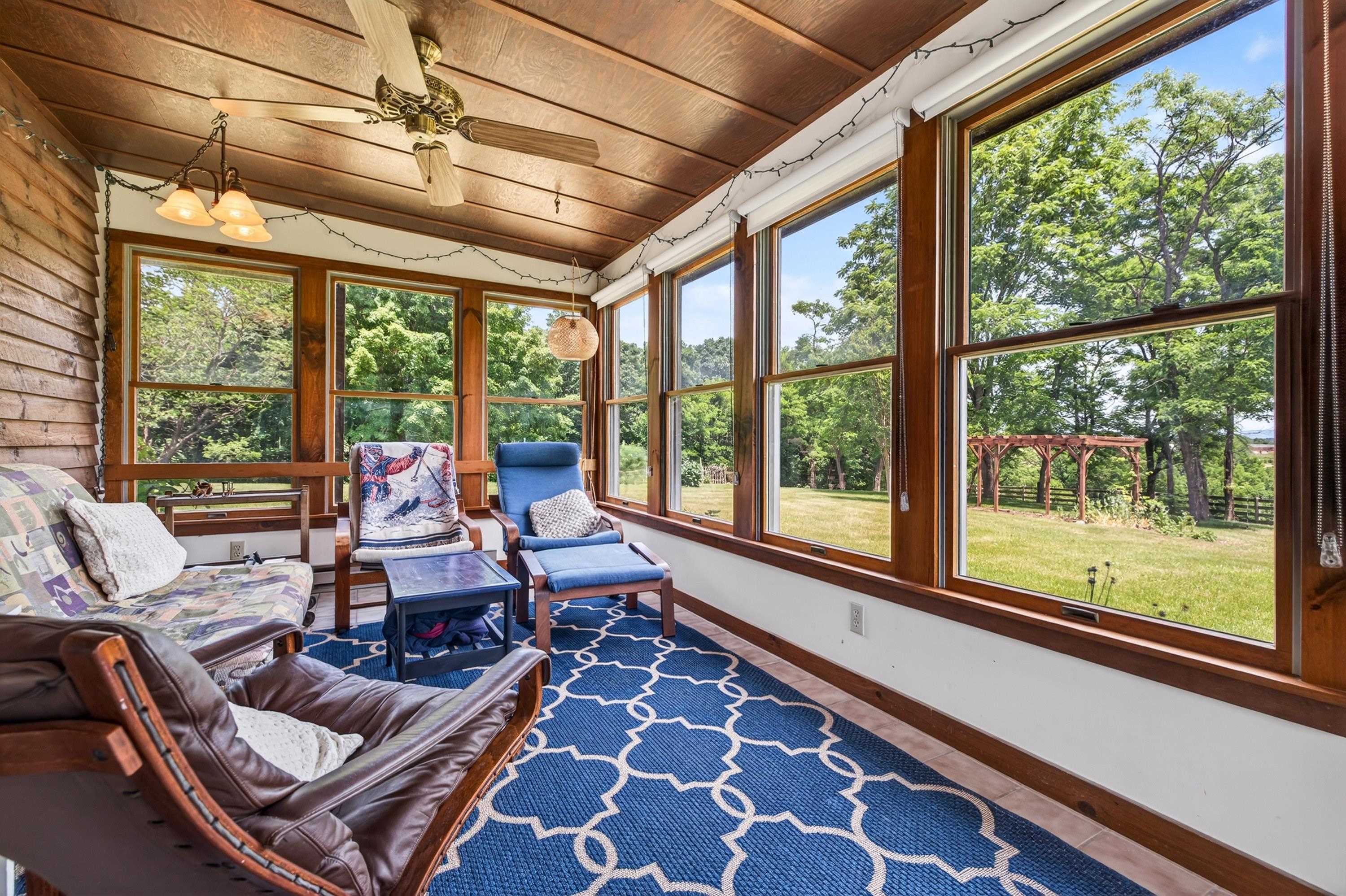 3980 Greenmount Road Harrisonburg, VA 22802 - Photo 16 of 75 This sunroom space offers an abundance of sunshine and overlooks the backyard of the home.