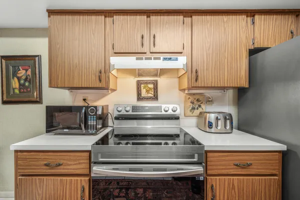 a kitchen with a stove and a microwave