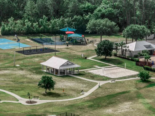 a swimming pool with outdoor seating yard and green space