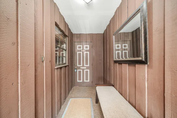 a view of a hallway with windows