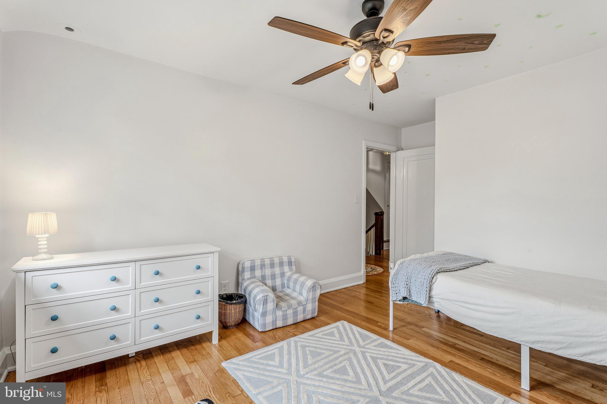 314 Murdock Road Baltimore, MD 21212 - Photo 21 of 42 a bedroom with a bed and a dresser