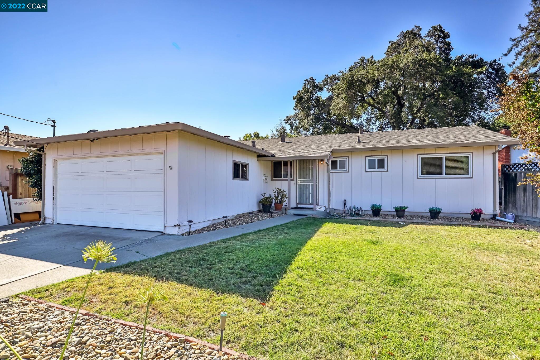 a view of a house with swimming pool in front of it