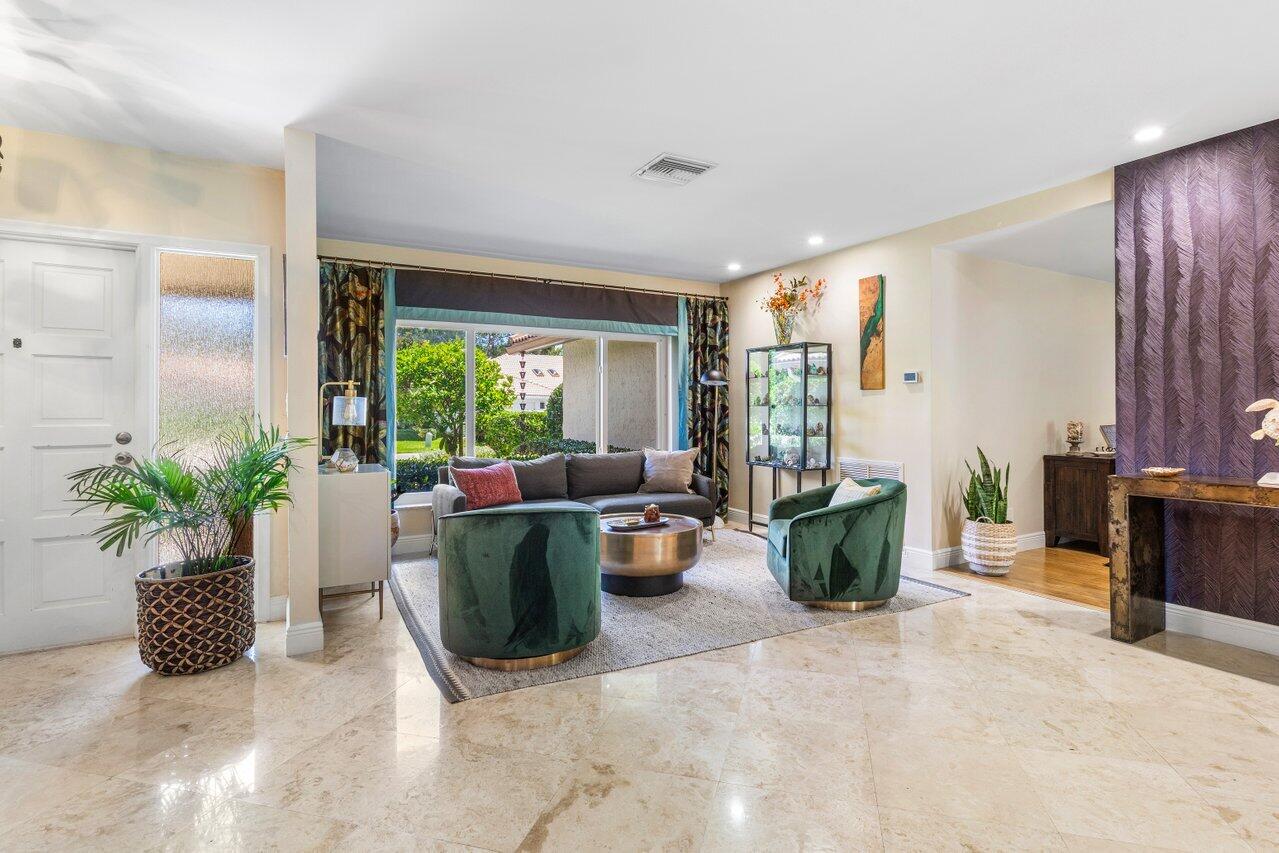 1935 Southwest 7th Court Boca Raton, FL 33486 - Photo 14 of 42 a living room with furniture and potted plants