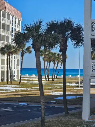 a view of ocean view with palm trees