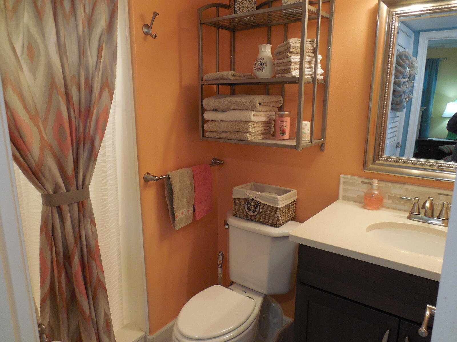 909 Santa Rosa Boulevard, Unit 229 Fort Walton Beach, FL 32548 - Photo 17 of 36 a bathroom with a sink toilet and mirror