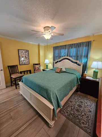 a bedroom with bed and a window