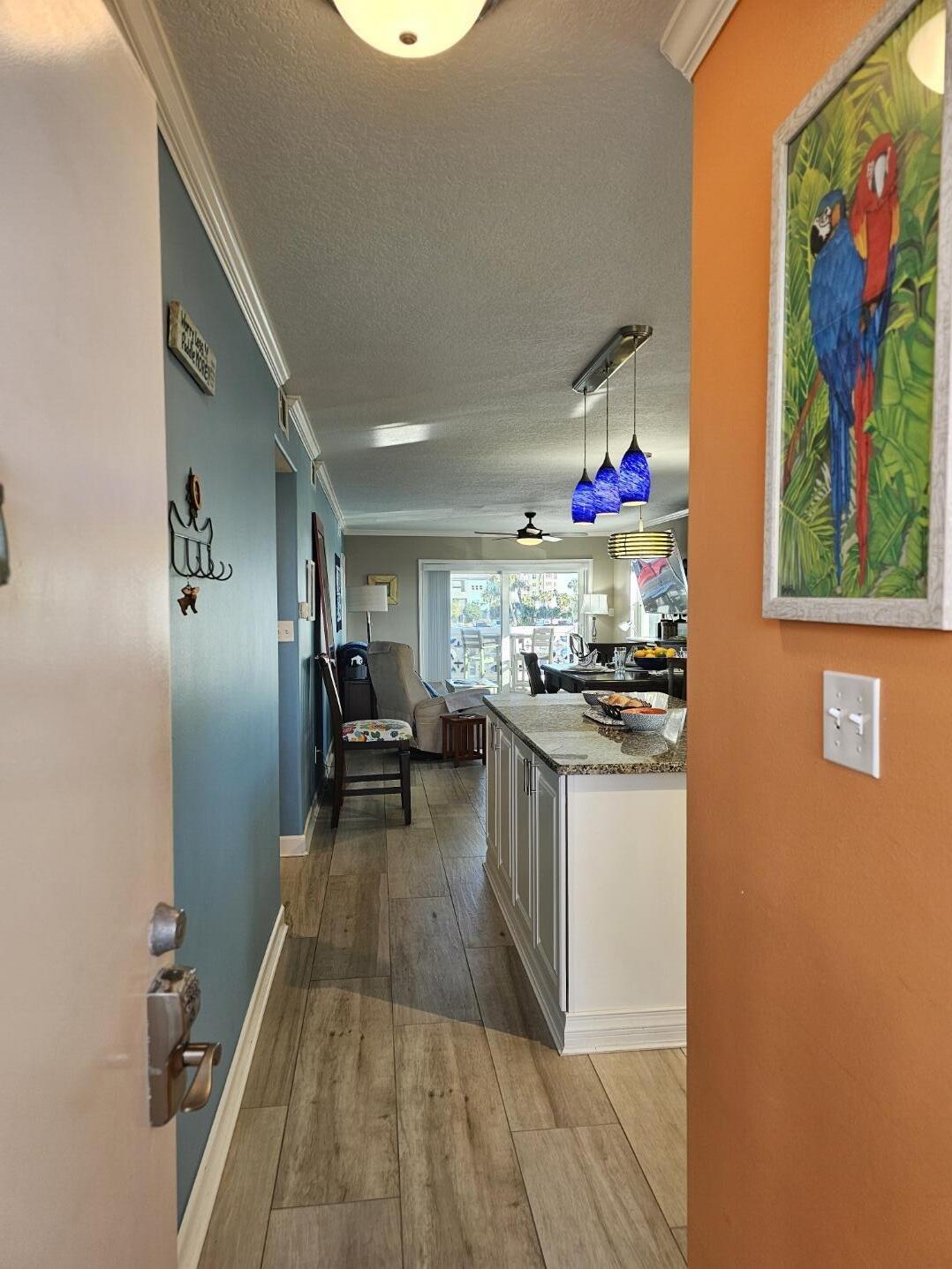 909 Santa Rosa Boulevard, Unit 229 Fort Walton Beach, FL 32548 - Photo 2 of 36 a kitchen with counter top space and wooden floor