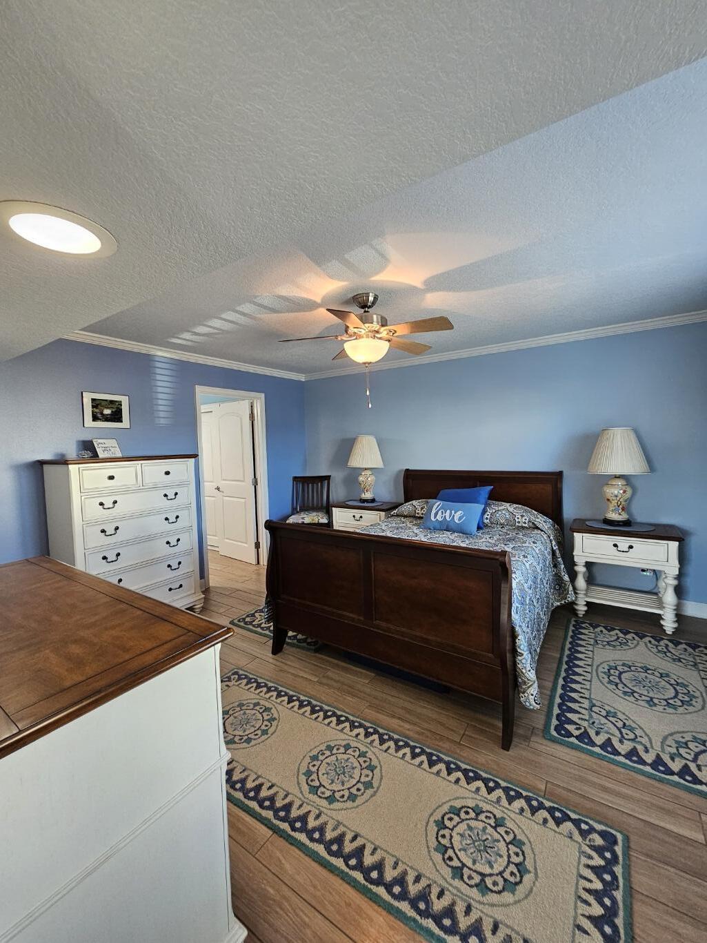 909 Santa Rosa Boulevard, Unit 229 Fort Walton Beach, FL 32548 - Photo 22 of 36 a bedroom with a bed and a dresser