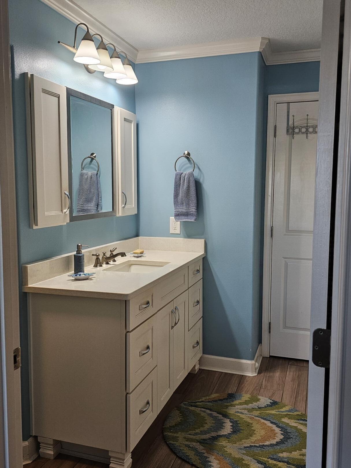 909 Santa Rosa Boulevard, Unit 229 Fort Walton Beach, FL 32548 - Photo 25 of 36 a bathroom with a sink and a mirror