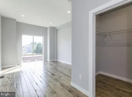 a view of hallway with wooden floor