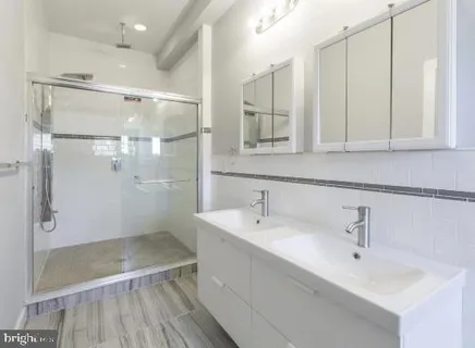 a bathroom with a bathtub and a sink