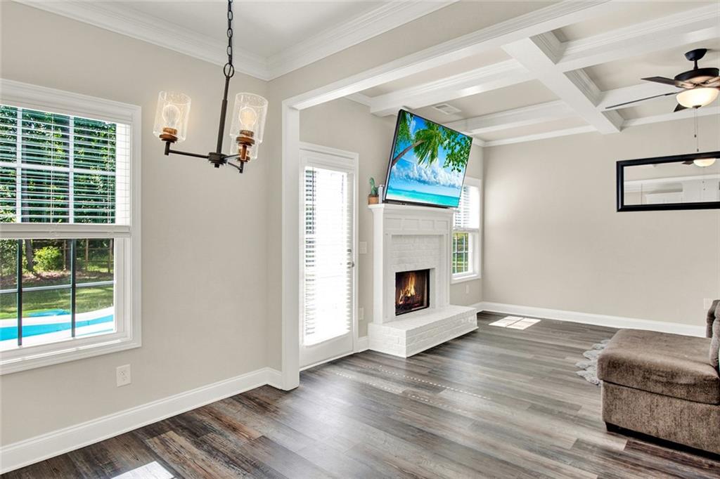 407 Corinth Church Road Winder, GA 30680 - Photo 22 of 66 a living room with furniture and a fireplace