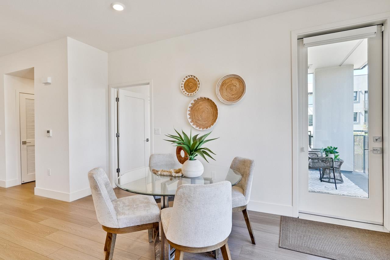 3698 Vision Common, Unit 221 Fremont, CA 94538 - Photo 11 of 62 a dining room with furniture and a potted plant