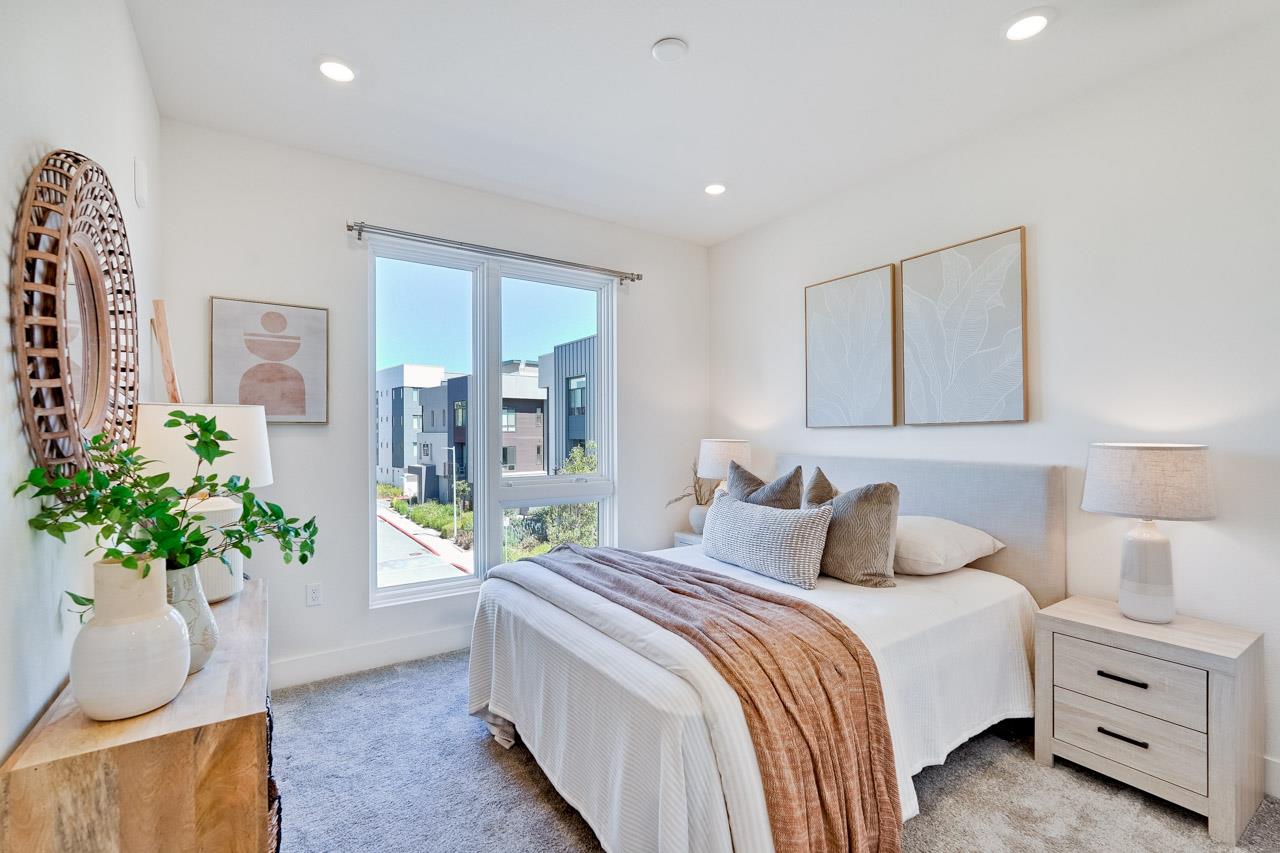 3698 Vision Common, Unit 221 Fremont, CA 94538 - Photo 19 of 62 a bedroom with a bed and a potted plant