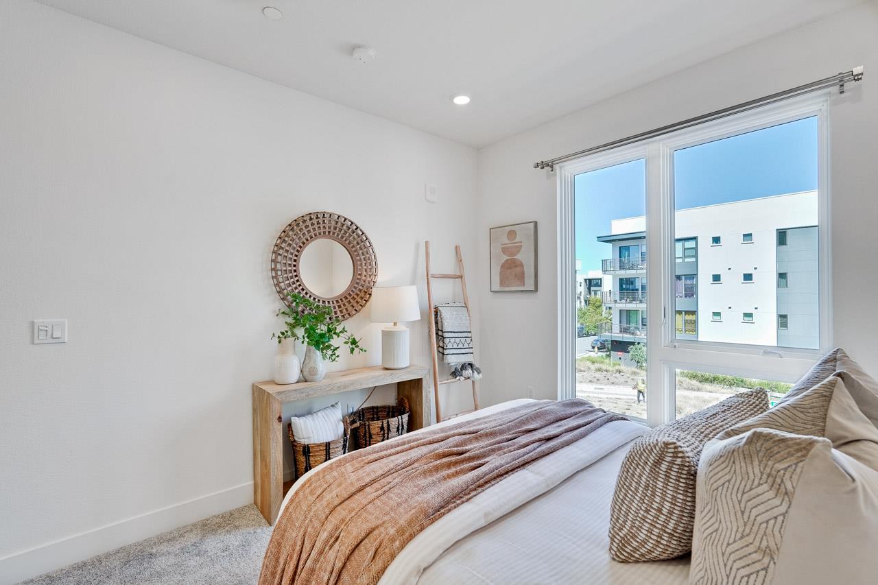 3698 Vision Common, Unit 221 Fremont, CA 94538 - Photo 22 of 62 a bedroom with a bed and a large window