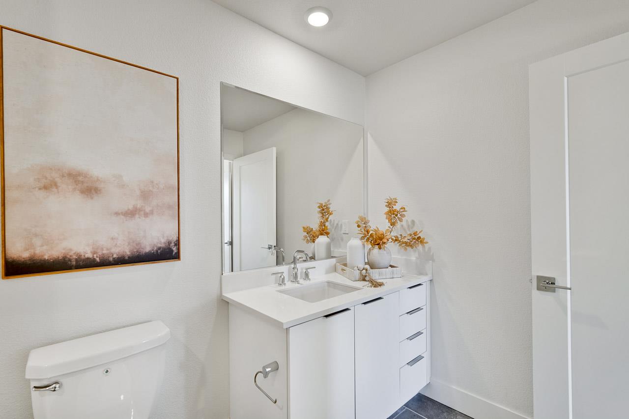 3698 Vision Common, Unit 221 Fremont, CA 94538 - Photo 26 of 62 a bathroom with a sink and a mirror