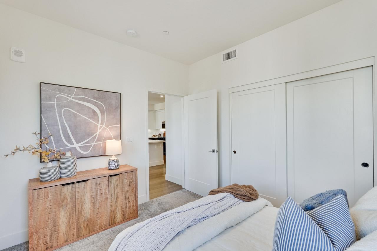 3698 Vision Common, Unit 221 Fremont, CA 94538 - Photo 29 of 62 a bedroom with a bed and wooden floor