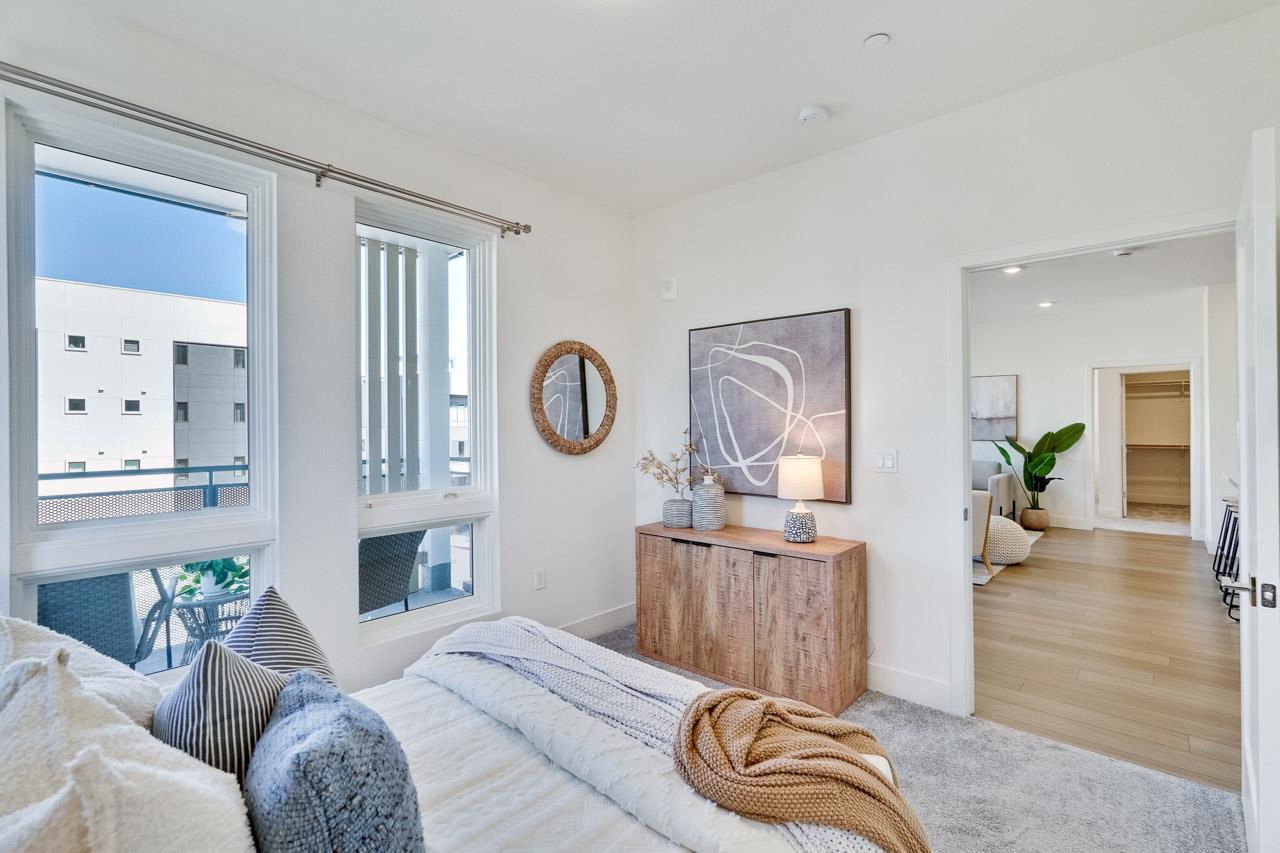 3698 Vision Common, Unit 221 Fremont, CA 94538 - Photo 30 of 62 a living room with furniture a window and a potted plant