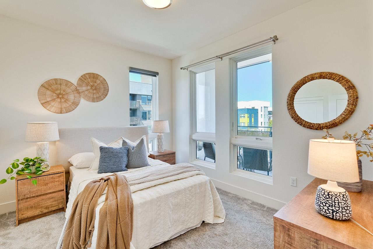 3698 Vision Common, Unit 221 Fremont, CA 94538 - Photo 31 of 62 a bedroom with a bed and a chandelier