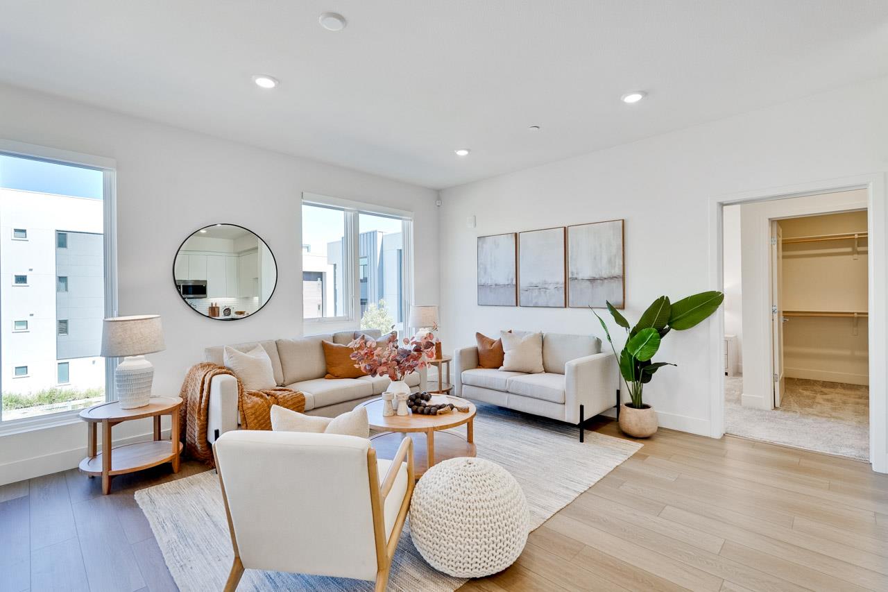 3698 Vision Common, Unit 221 Fremont, CA 94538 - Photo 4 of 62 a living room with furniture a rug potted plant and a window