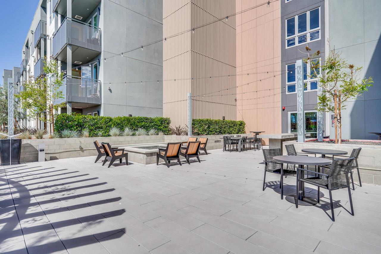 3698 Vision Common, Unit 221 Fremont, CA 94538 - Photo 44 of 62 a view of a patio with table and chairs and potted plants