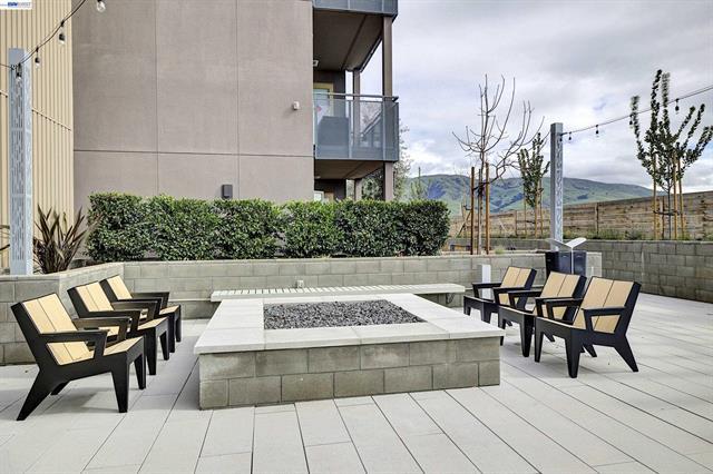 3698 Vision Common, Unit 221 Fremont, CA 94538 - Photo 45 of 62 a view of a patio with table and chairs and potted plants