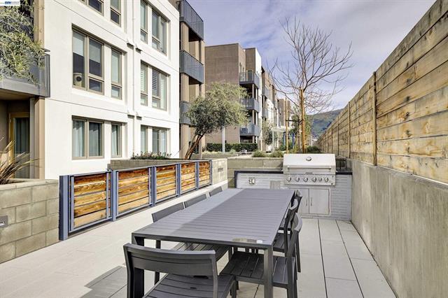 3698 Vision Common, Unit 221 Fremont, CA 94538 - Photo 47 of 62 a view of a patio with table and chairs