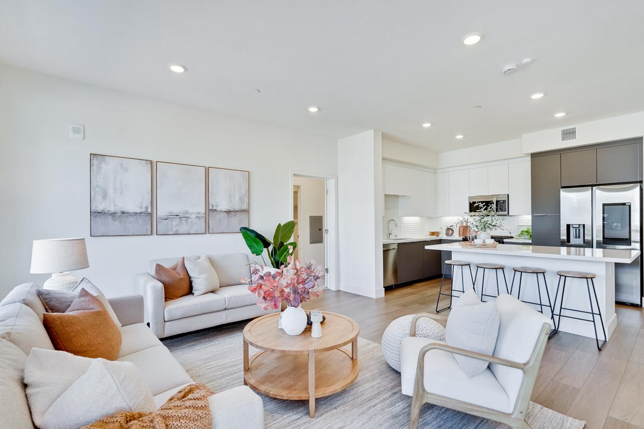 3698 Vision Common, Unit 221 Fremont, CA 94538 - Photo 5 of 62 a living room with furniture kitchen view and a table