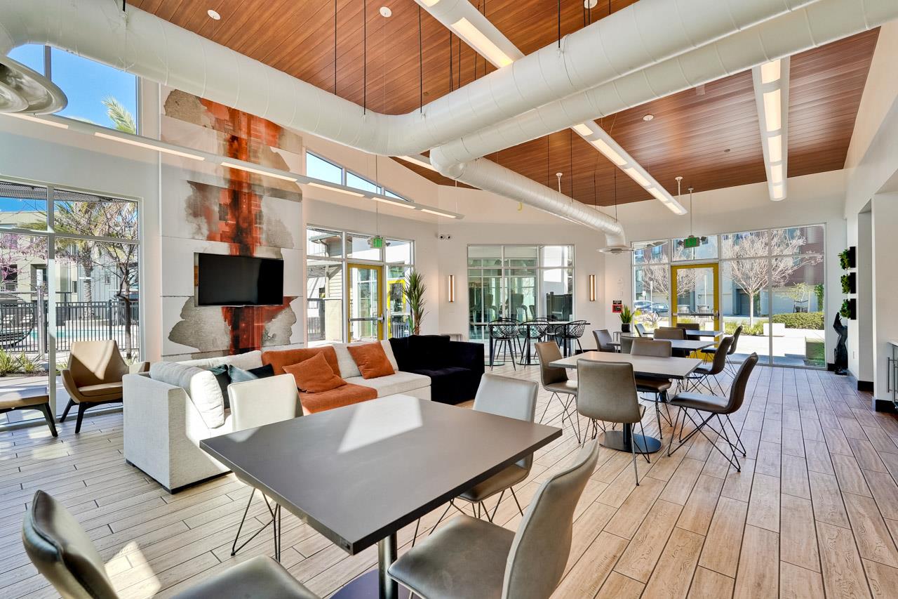 3698 Vision Common, Unit 221 Fremont, CA 94538 - Photo 56 of 62 a living room with lots of furniture and view of kitchen