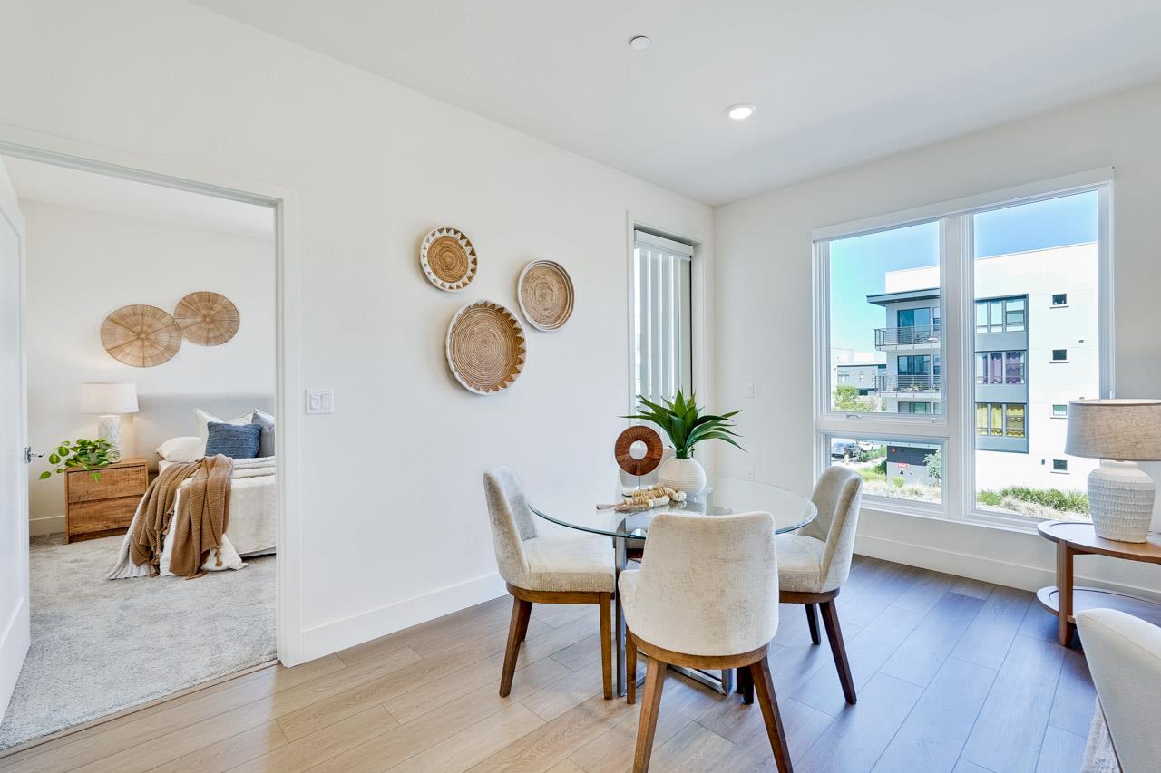 3698 Vision Common, Unit 221 Fremont, CA 94538 - Photo 8 of 62 a dining room with furniture and a large window