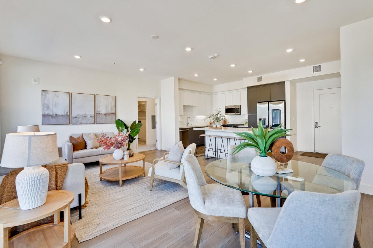 3698 Vision Common, Unit 221 Fremont, CA 94538 - Photo 10 of 62 a living room with furniture kitchen area and a potted plant