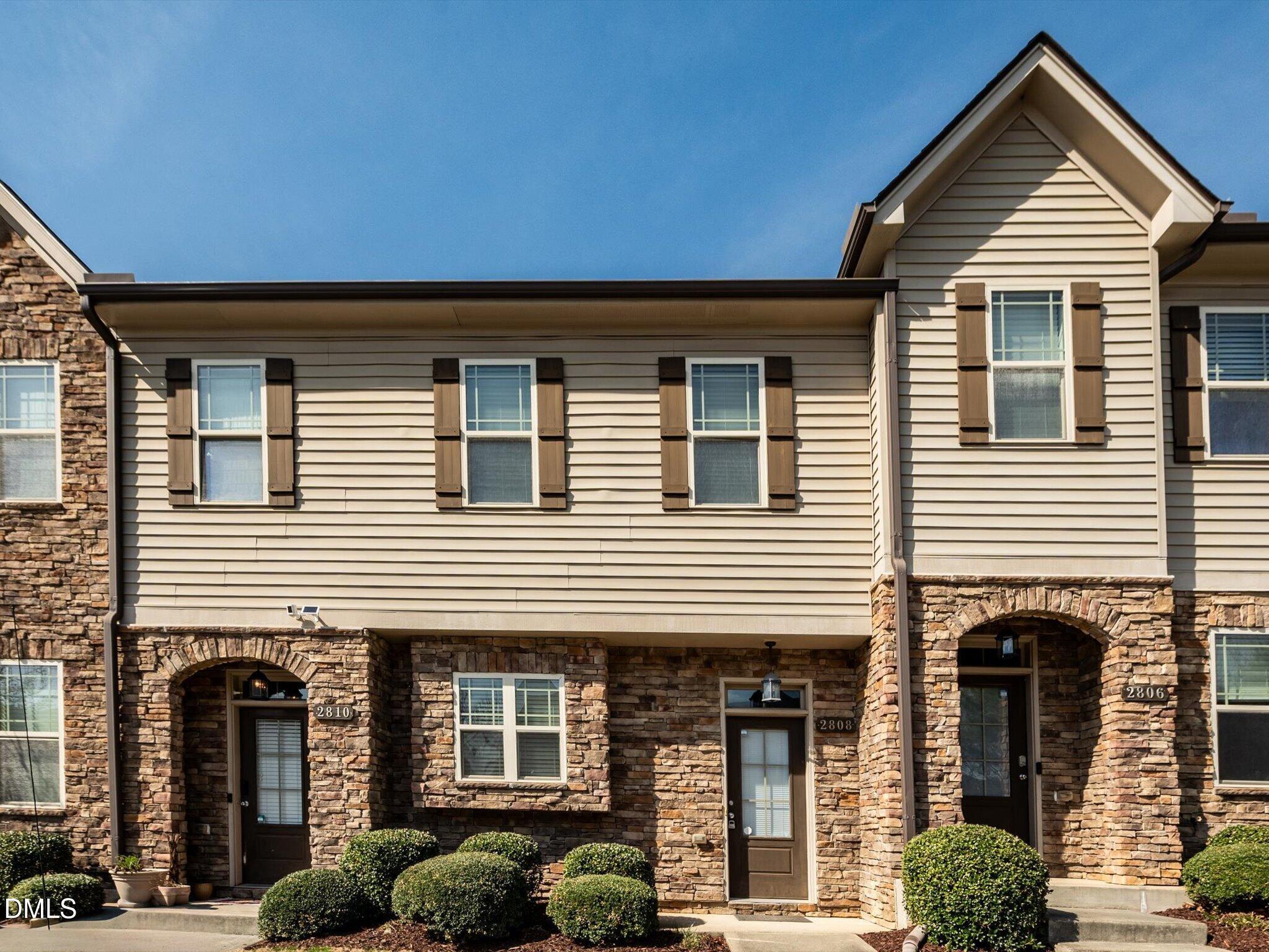2808 Piedmont River Way Raleigh, NC 27606 - Photo 1 of 28 a front view of a house with plants