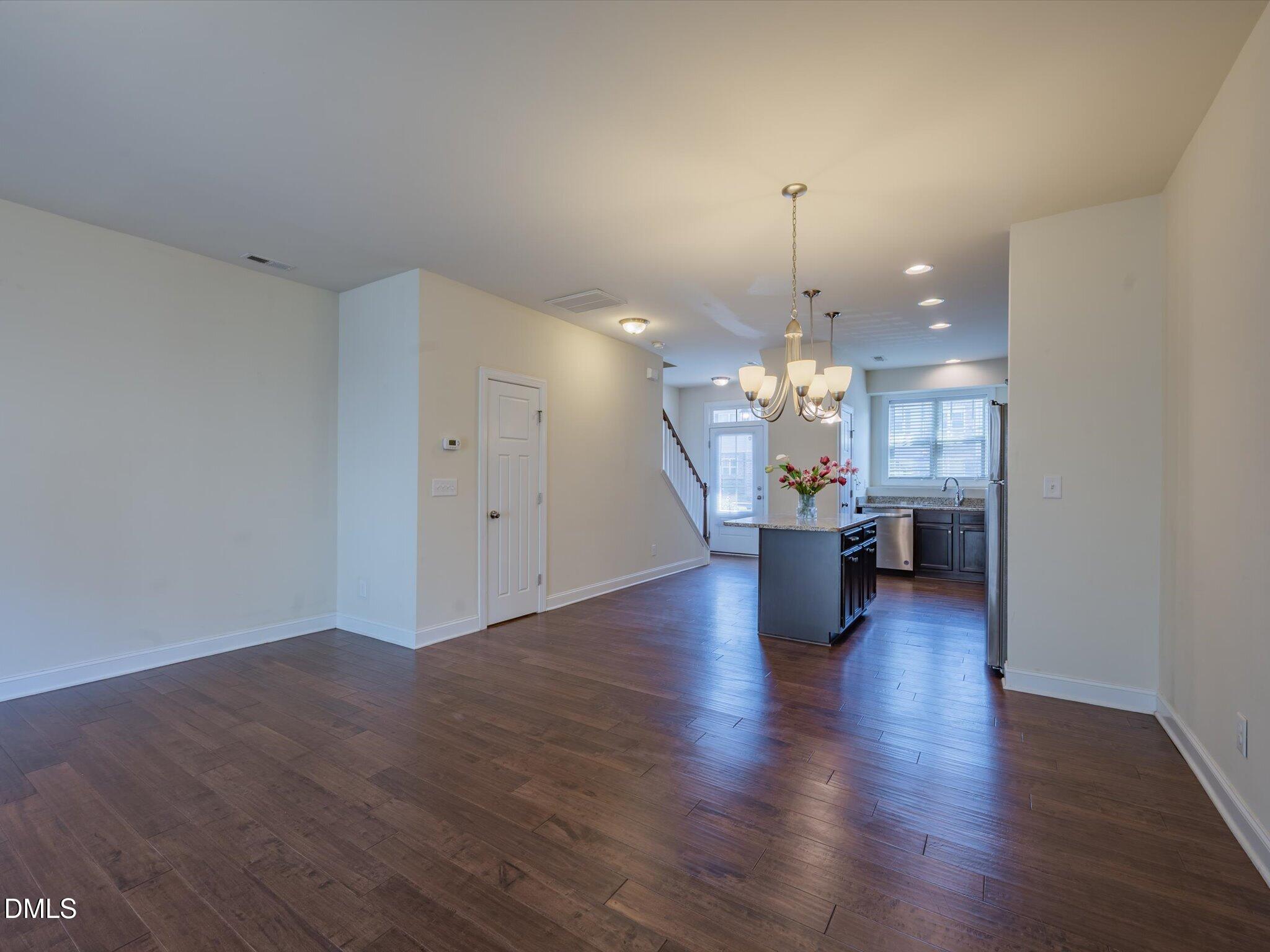 2808 Piedmont River Way Raleigh, NC 27606 - Photo 12 of 28 a view of a kitchen and a chandelier fan