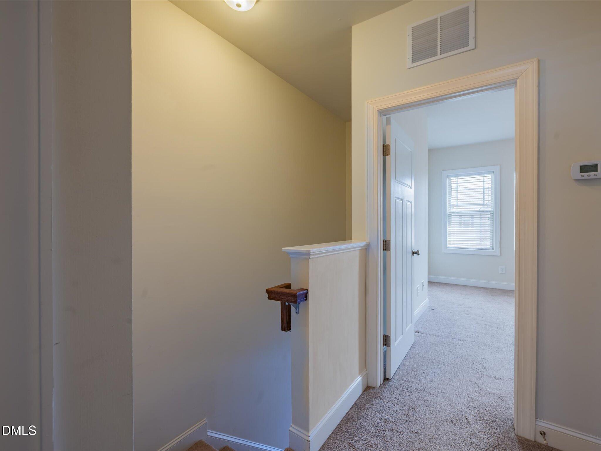 2808 Piedmont River Way Raleigh, NC 27606 - Photo 17 of 28 a view of a bathroom from a hallway