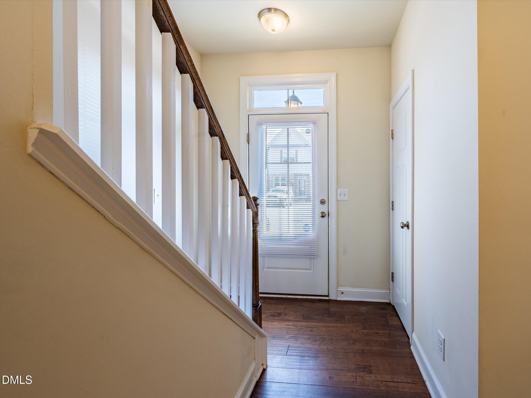 2808 Piedmont River Way Raleigh, NC 27606 - Photo 3 of 28 a view of a hallway with wooden floor and entryway
