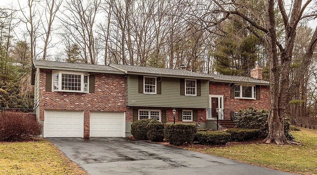 a front view of a house with yard