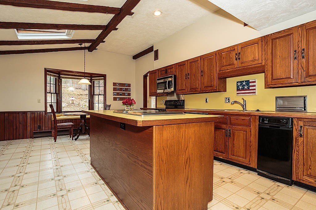 10 Marina Road Chelmsford, MA 01824 - Photo 14 of 30 a kitchen with stainless steel appliances granite countertop a stove sink and cabinets