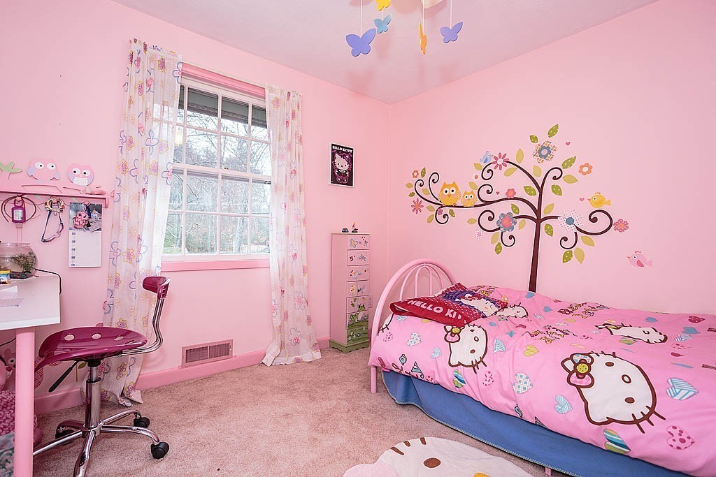 10 Marina Road Chelmsford, MA 01824 - Photo 18 of 30 a bedroom with a bed and a chandelier