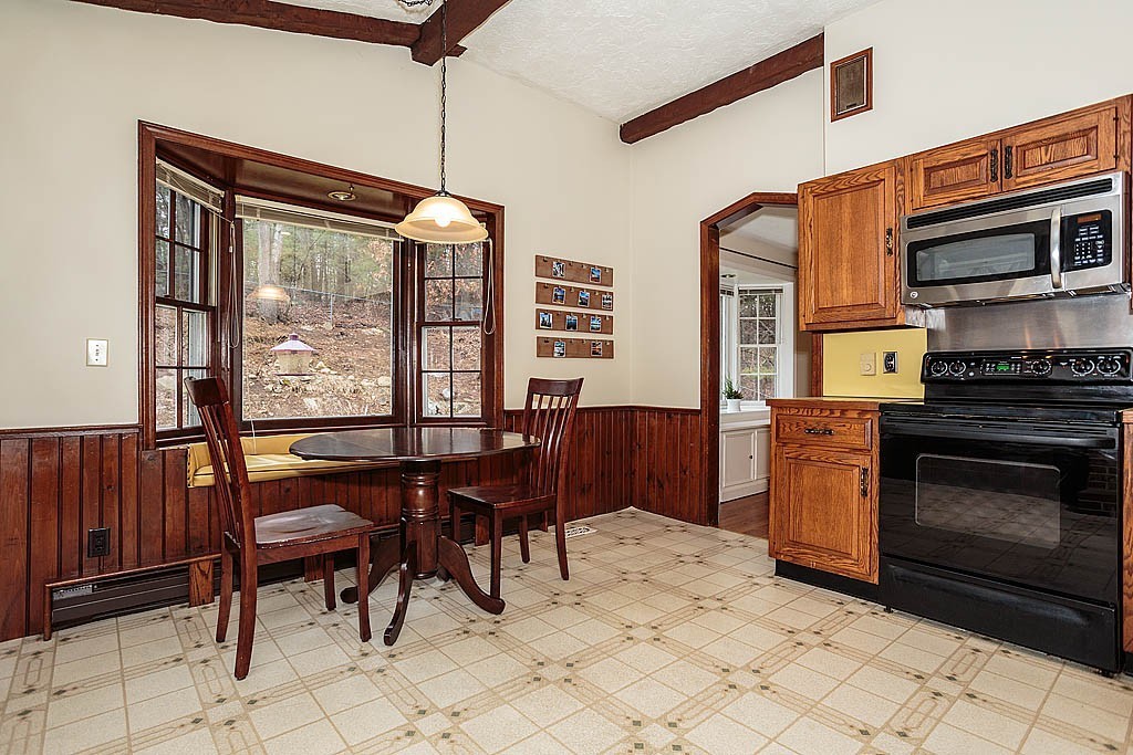 10 Marina Road Chelmsford, MA 01824 - Photo 4 of 30 a kitchen with stainless steel appliances granite countertop a stove a sink and a microwave
