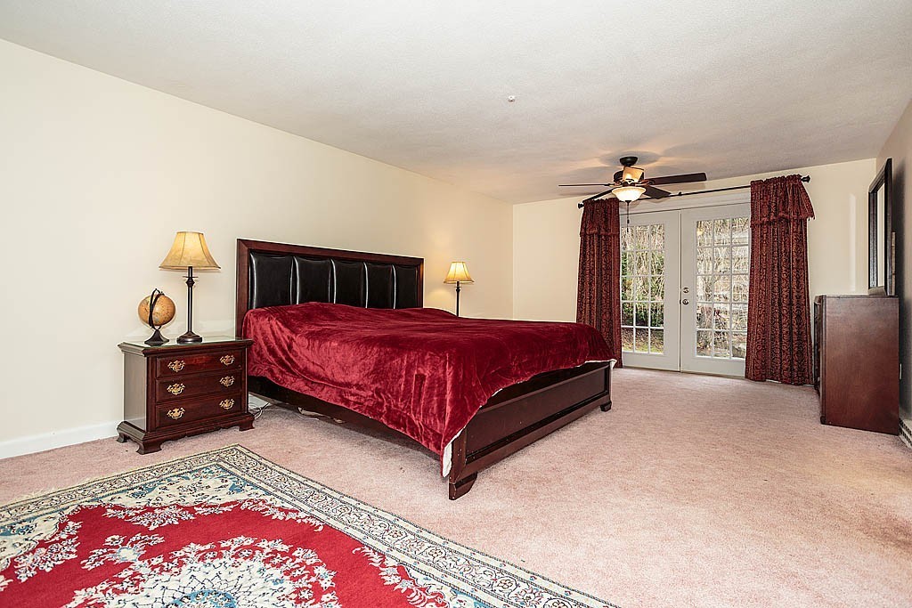 10 Marina Road Chelmsford, MA 01824 - Photo 7 of 30 a bedroom with a bed and window