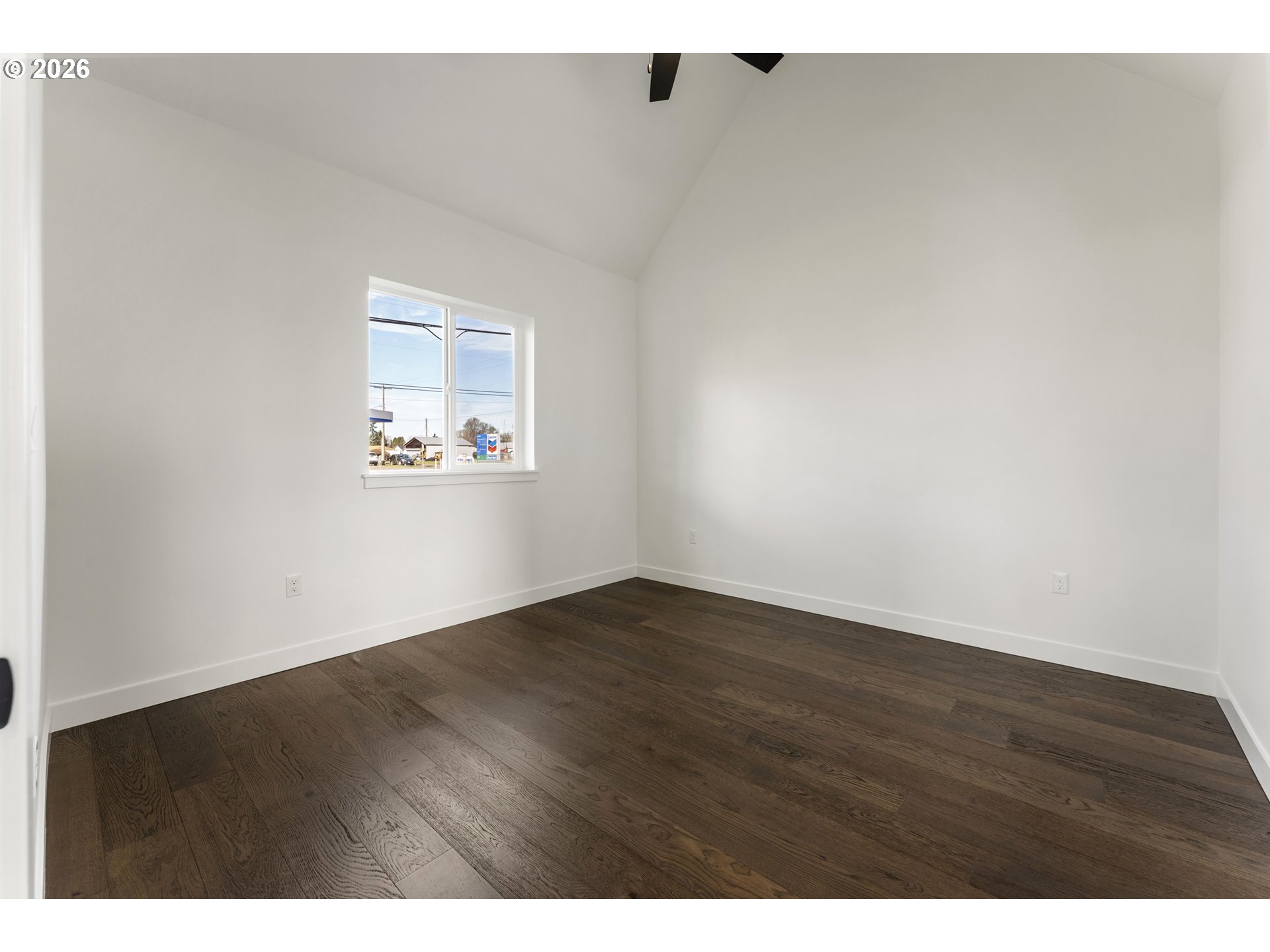 413 South Trade Street Amity, OR 97101 - Photo 16 of 42 a view of an empty room with wooden floor and a window