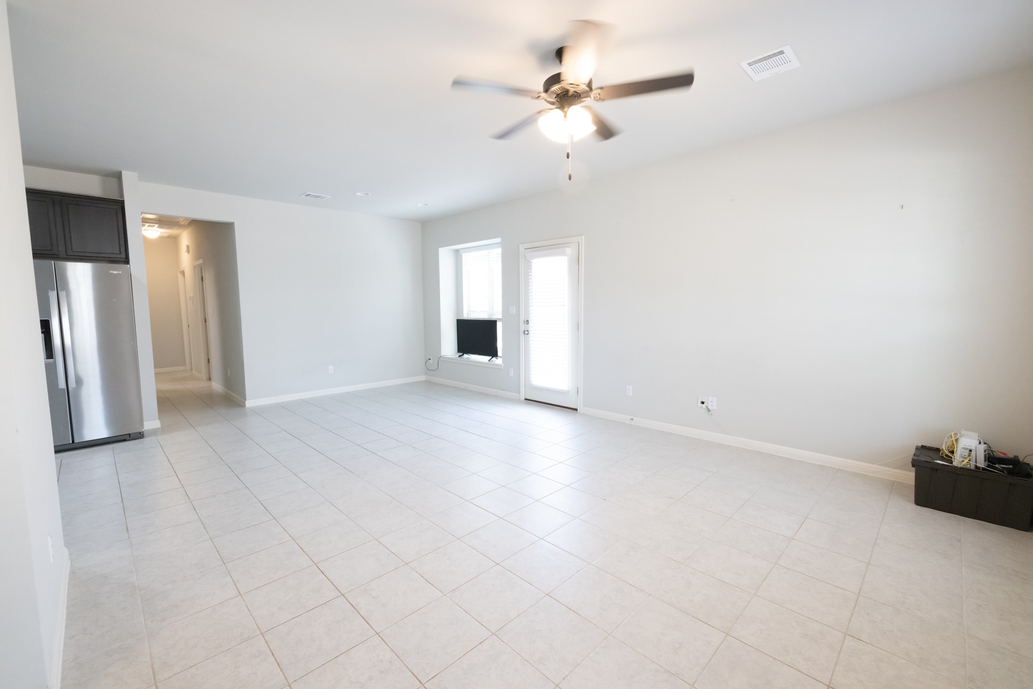 2809 Seneca Path, Unit 30 Leander, TX 78641 - Photo 11 of 30 wooden floor in an empty room with a window