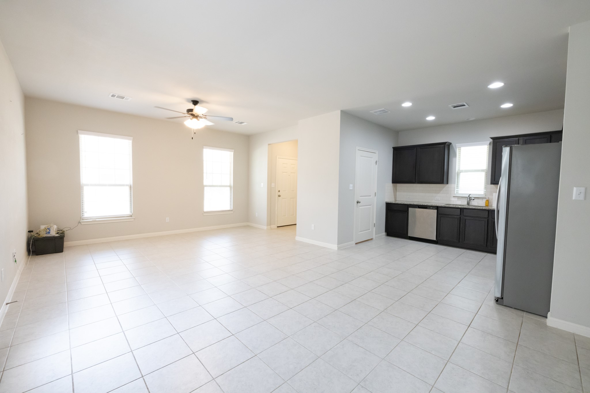 2809 Seneca Path, Unit 30 Leander, TX 78641 - Photo 12 of 30 a view of a kitchen with a sink and a fireplace