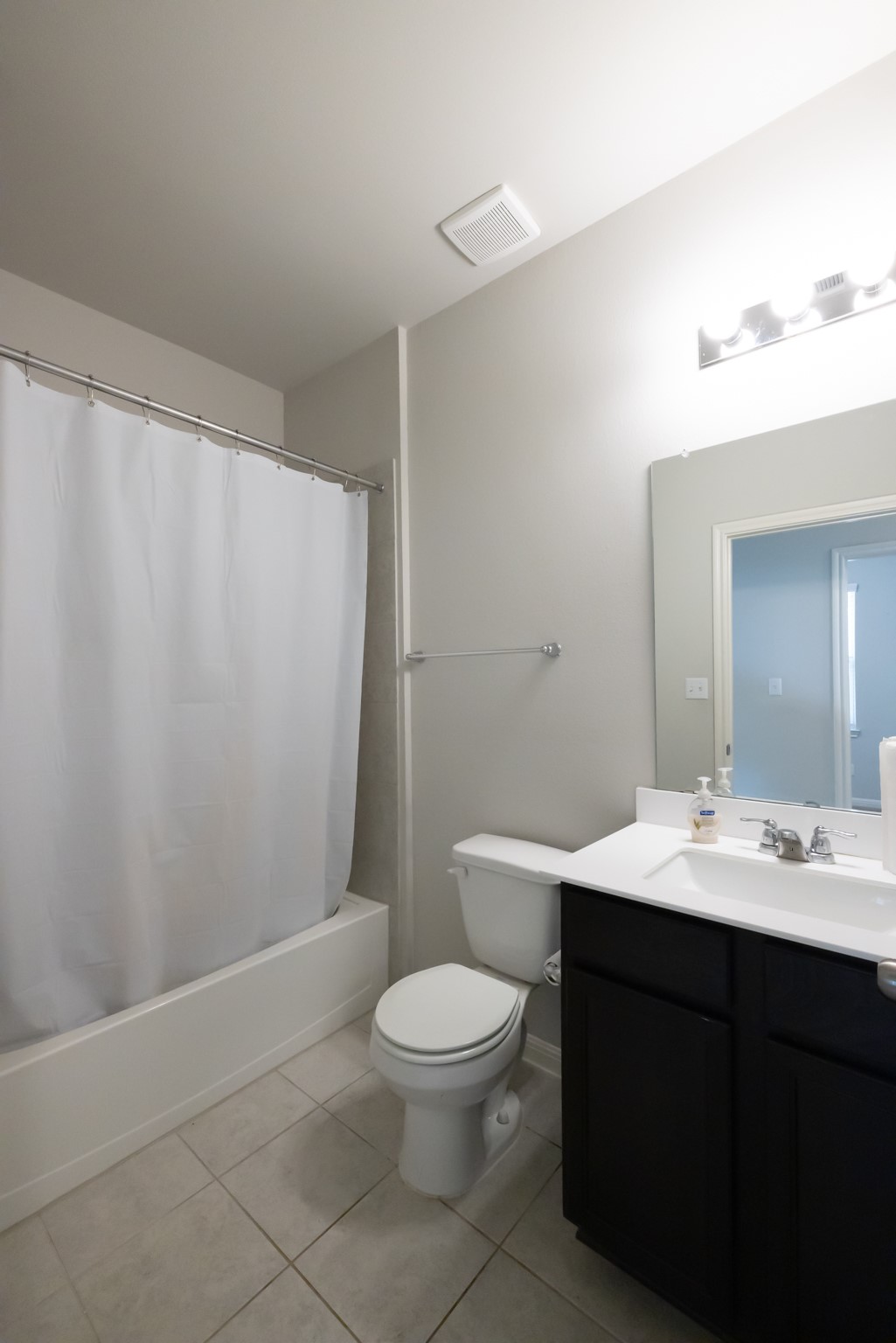 2809 Seneca Path, Unit 30 Leander, TX 78641 - Photo 16 of 30 a bathroom with a toilet a sink and a mirror